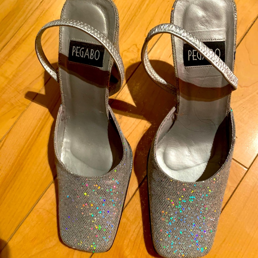 Previously worn, sparkly, silver shoes.
